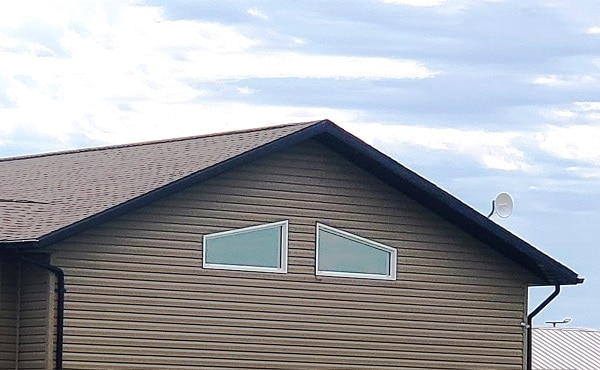 Trapezoid Window white with brown siding