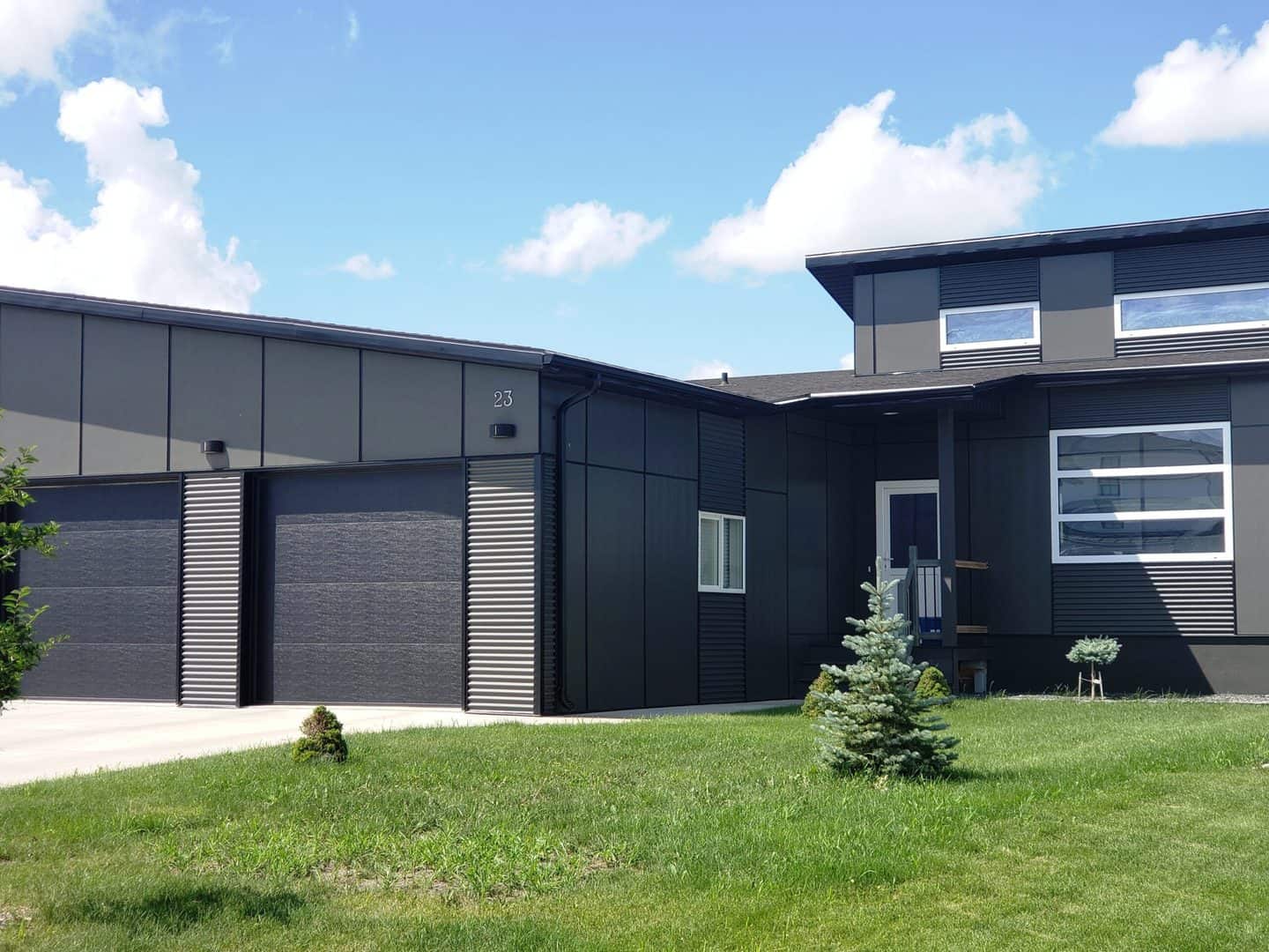 Grey contemporary house with white tilt and turn windows and doors