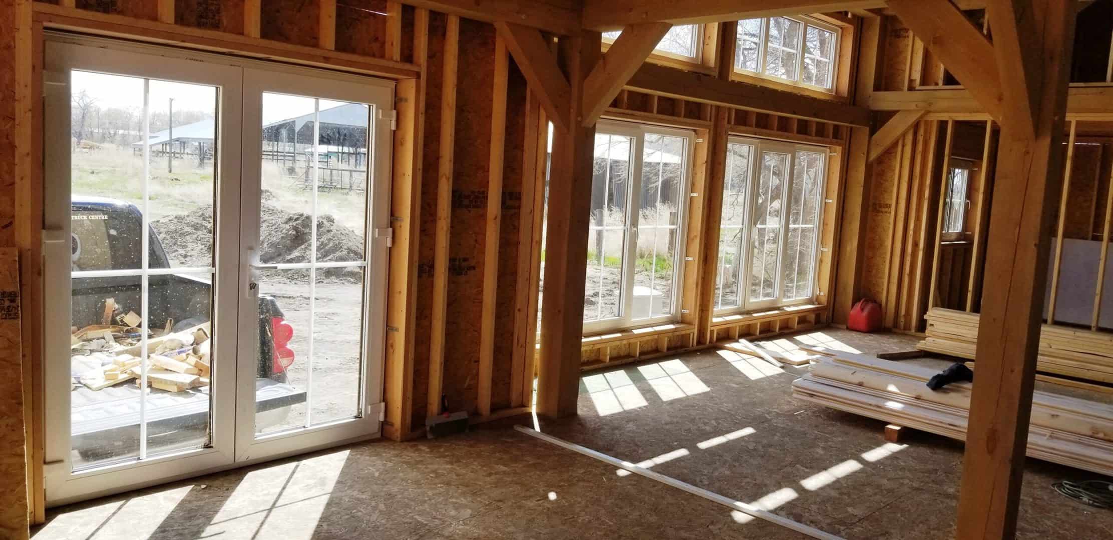 Frame house inside with white tilt and turn windows